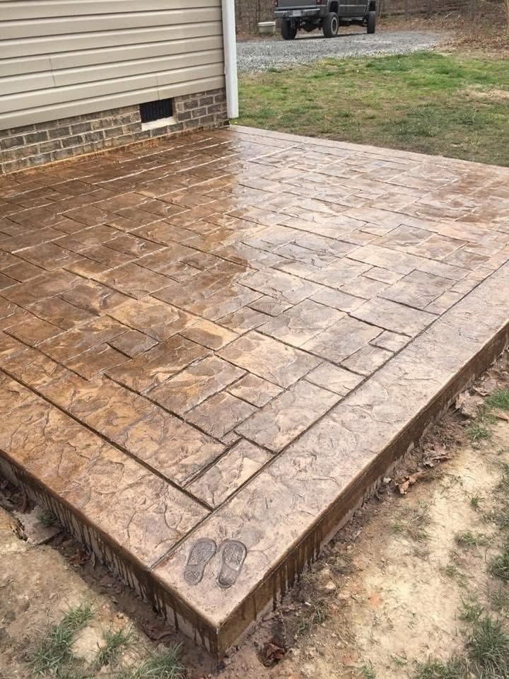 Stamped concrete patio with brick pattern finish
