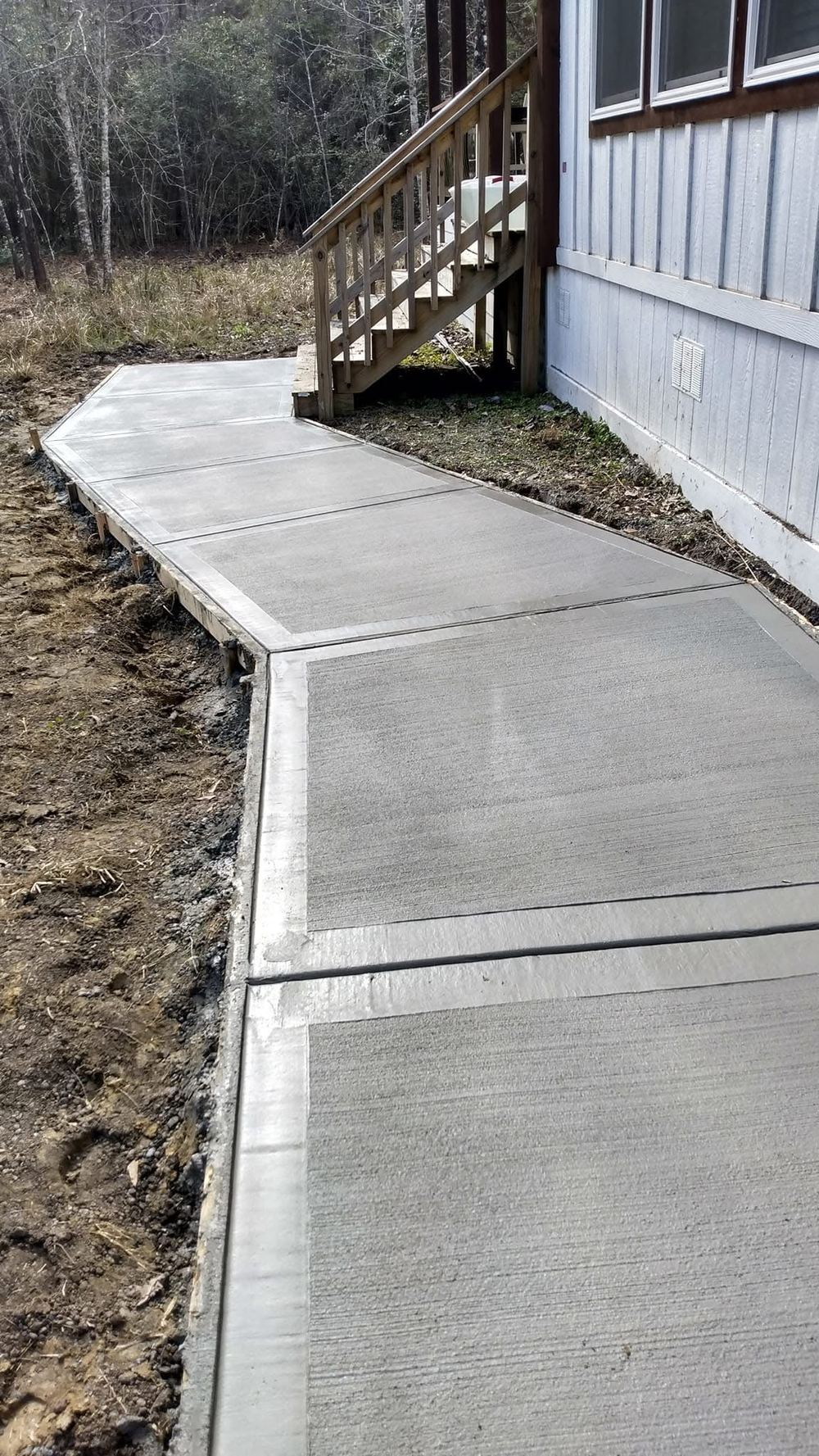 Freshly poured concrete walkway with border detail